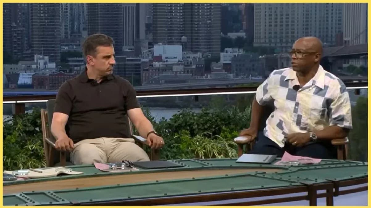 Two analysts seated at a discussion table outdoors