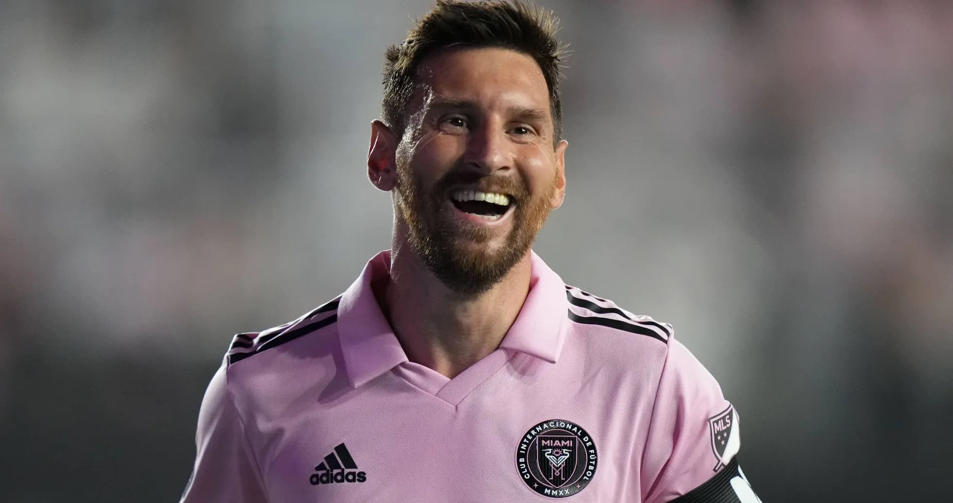 Player in pink jersey smiling during match