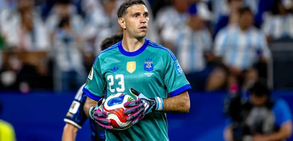 Goalkeeper holding ball during match