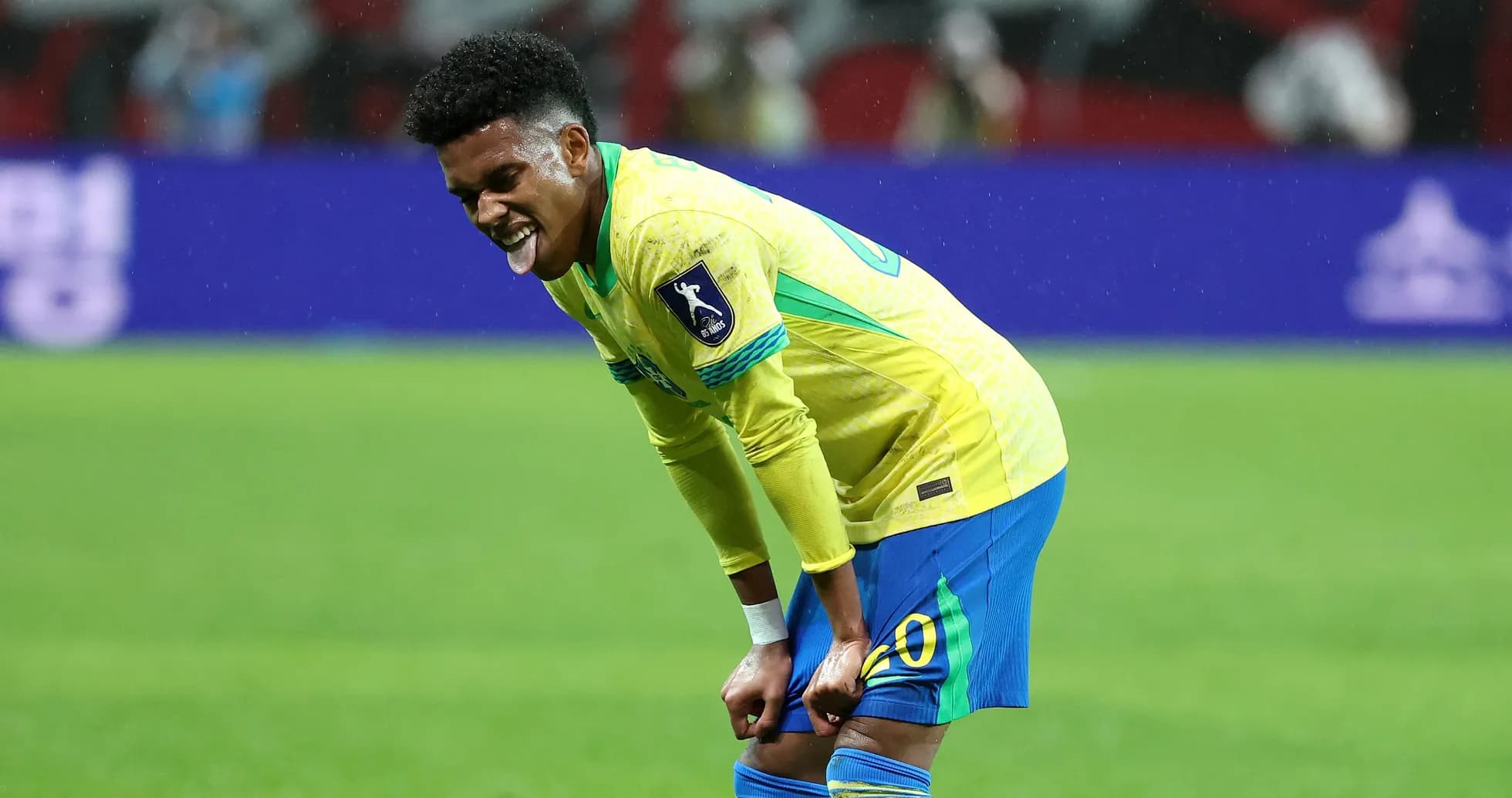 Player reacting during match in Brazil kit