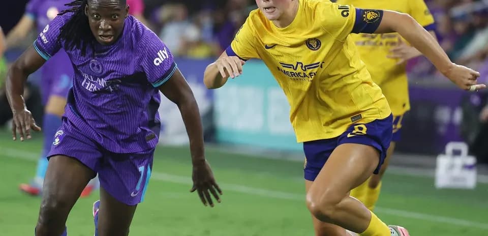 Two players competing during Orlando Pride match