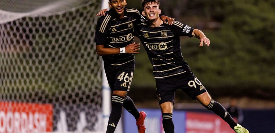Two Los Angeles FC II players celebrating a goal