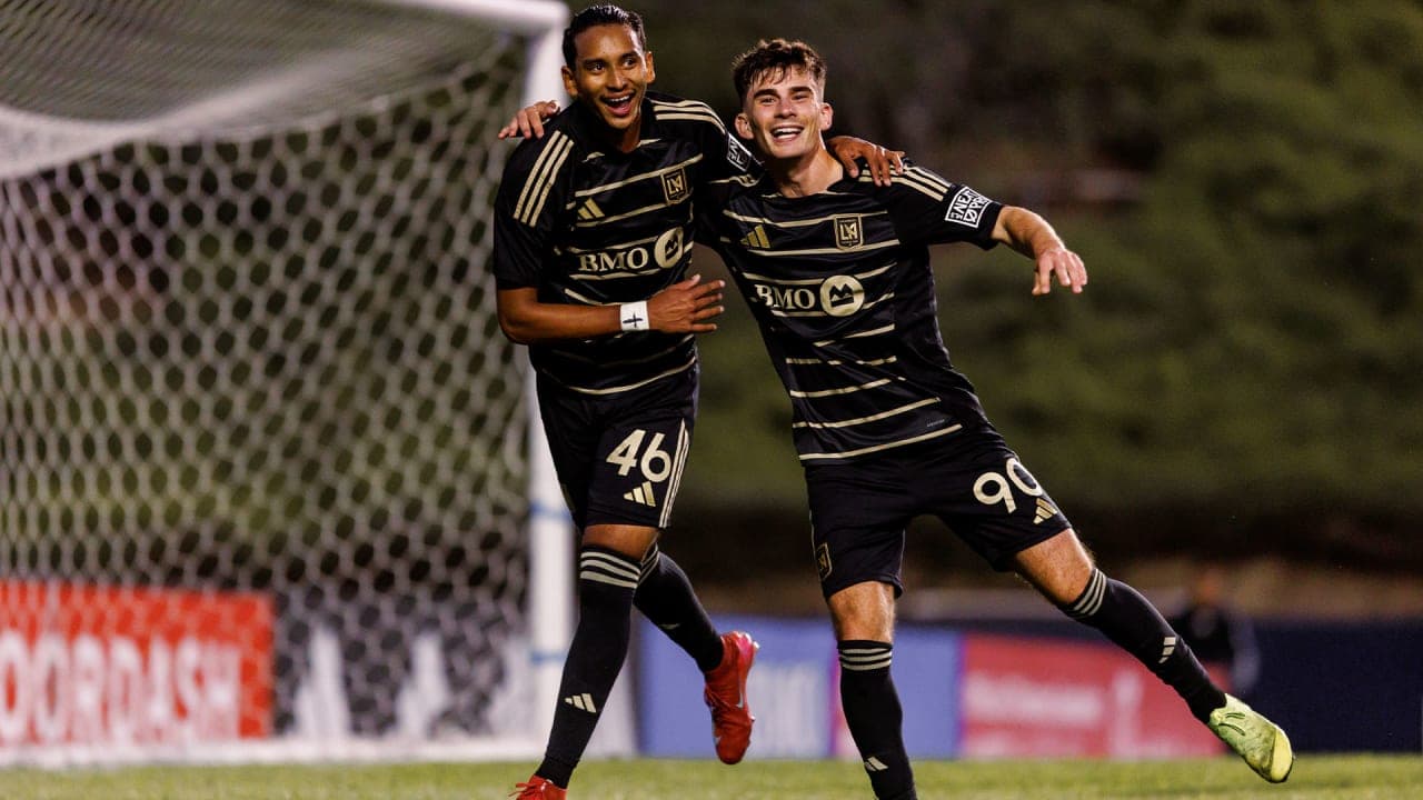Two Los Angeles FC II players celebrating a goal
