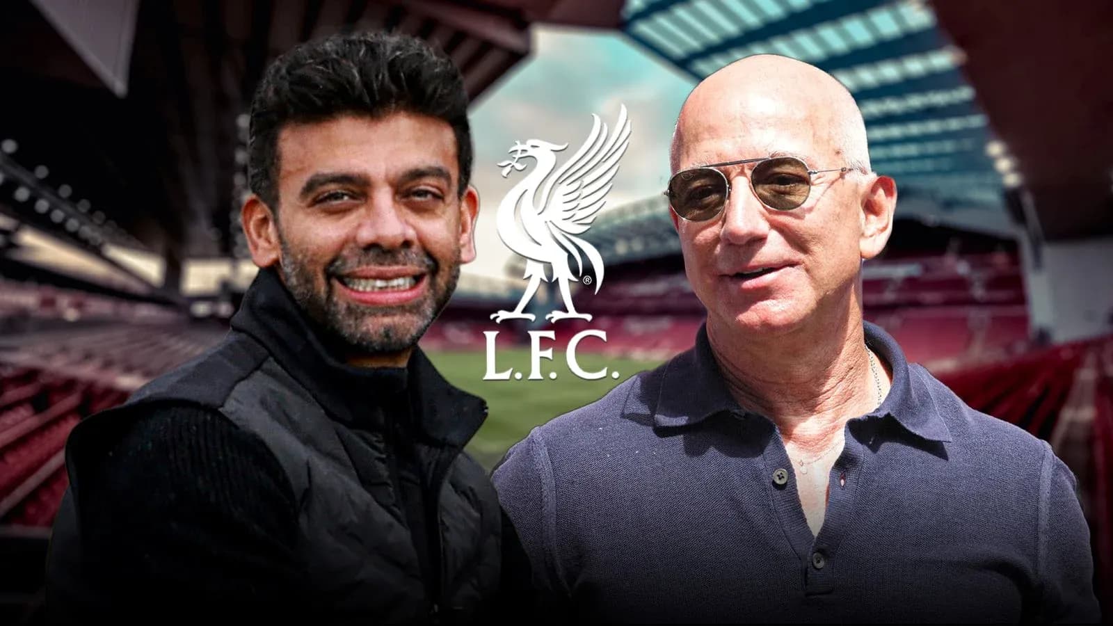 Two men smiling at Anfield stadium with L.F.C. logo