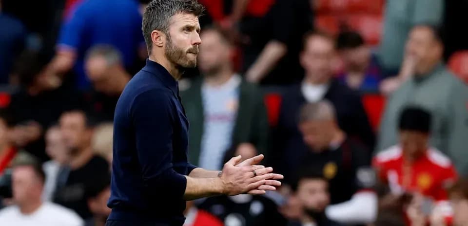 Manager clapping during match at Old Trafford