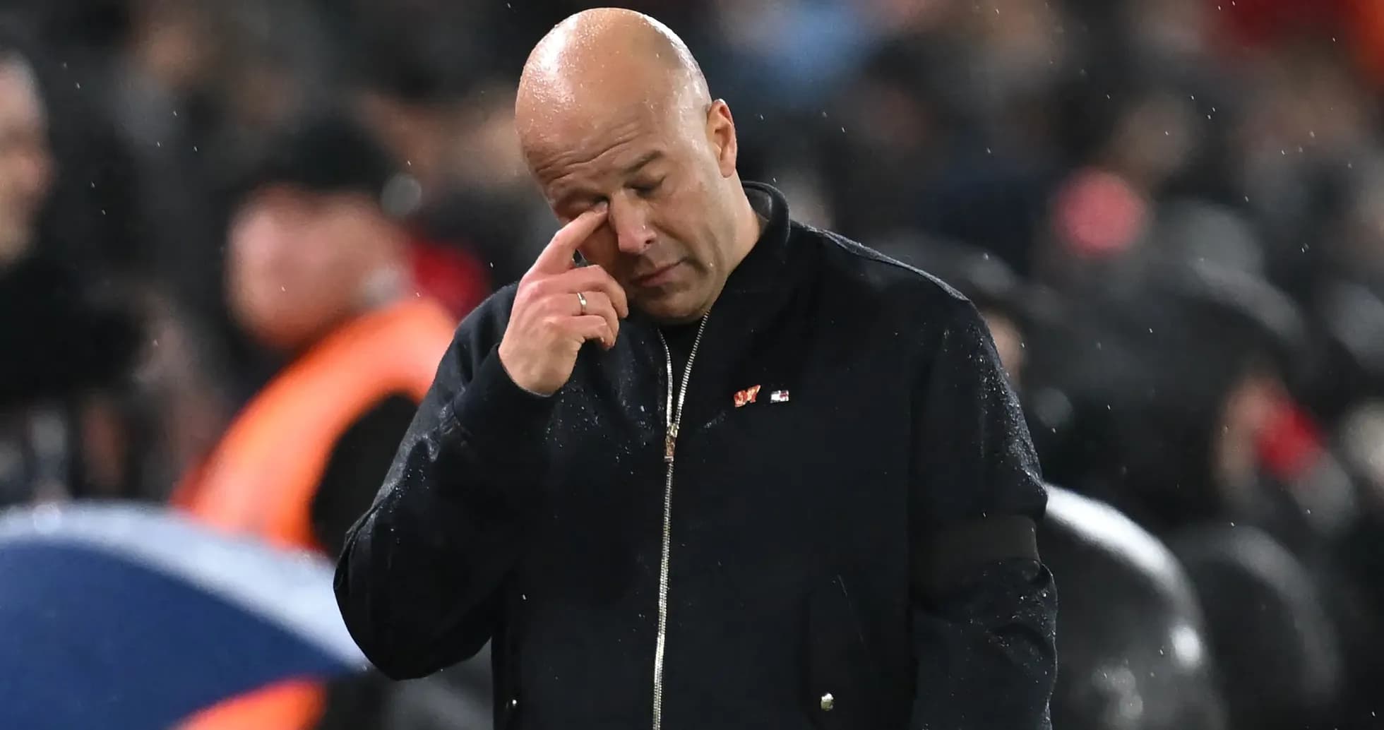 Coach wiping his eye during a match