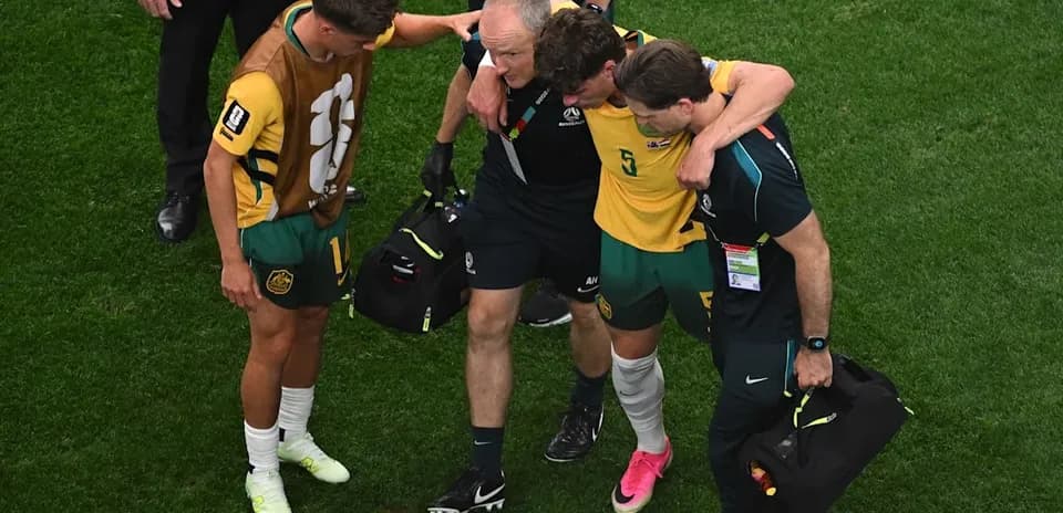 Player receiving assistance off the field after injury