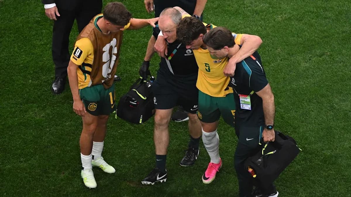 Player receiving assistance off the field after injury