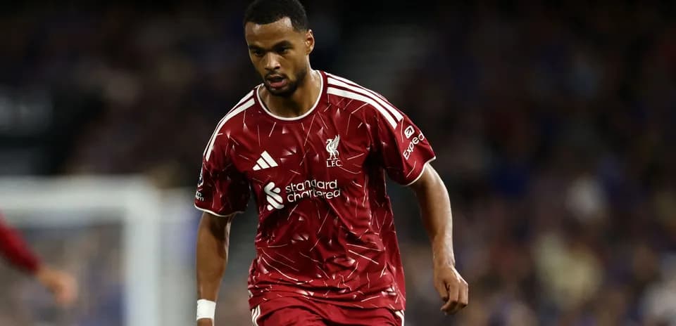Player in Liverpool kit running on the pitch