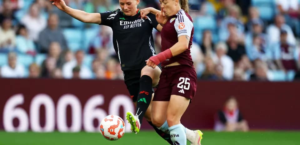 Players competing for the ball during match