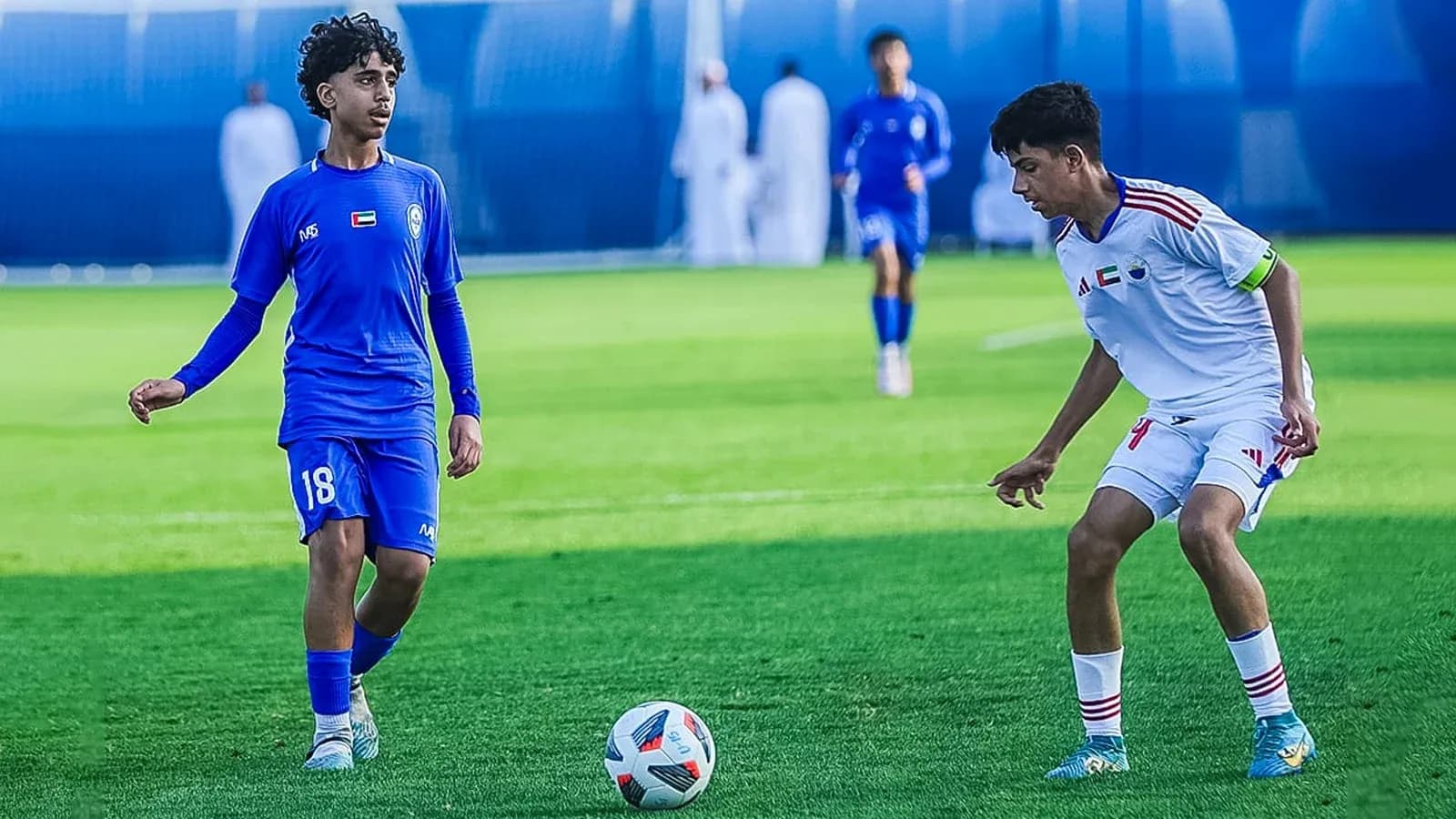 Two players competing in Ittihad Kalba U23 match