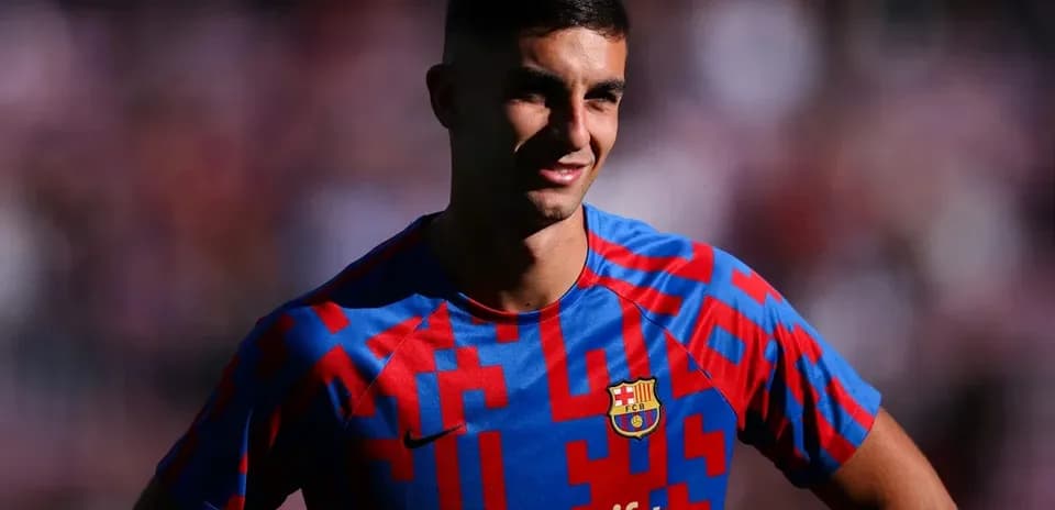 Player posing in FC Barcelona jersey during event