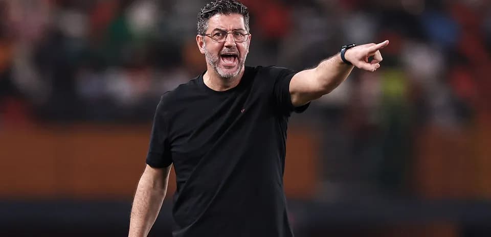 Coach directing players during a match