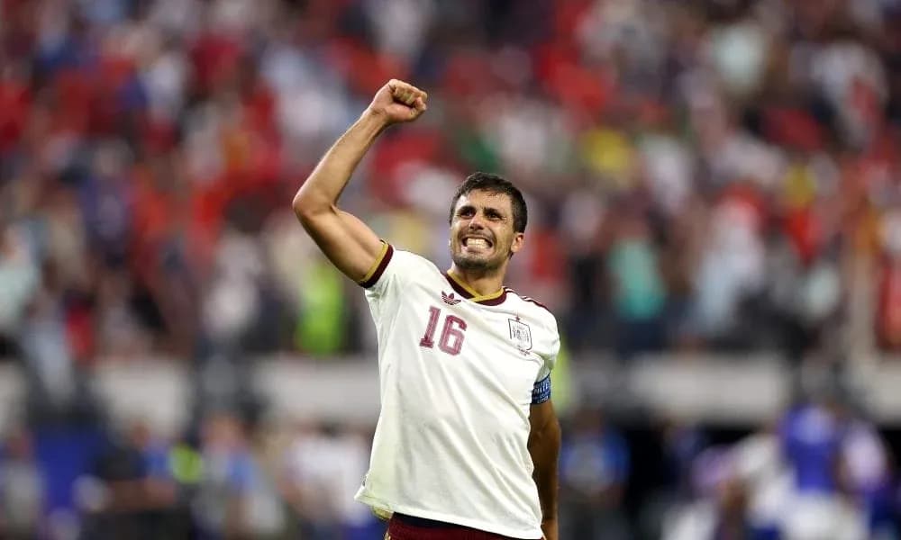 Player celebrating with raised fist in stadium