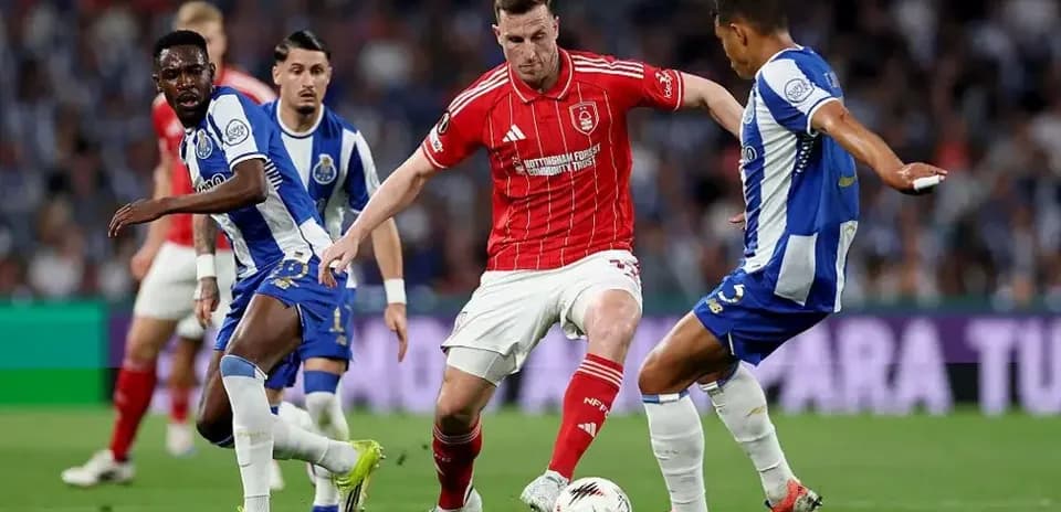 Players contesting the ball during a football match