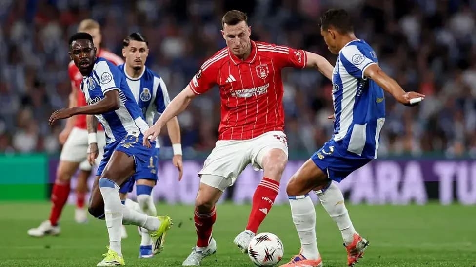 Players contesting the ball during a football match