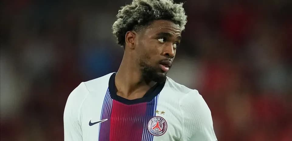 Player in PSG jersey looking away during match