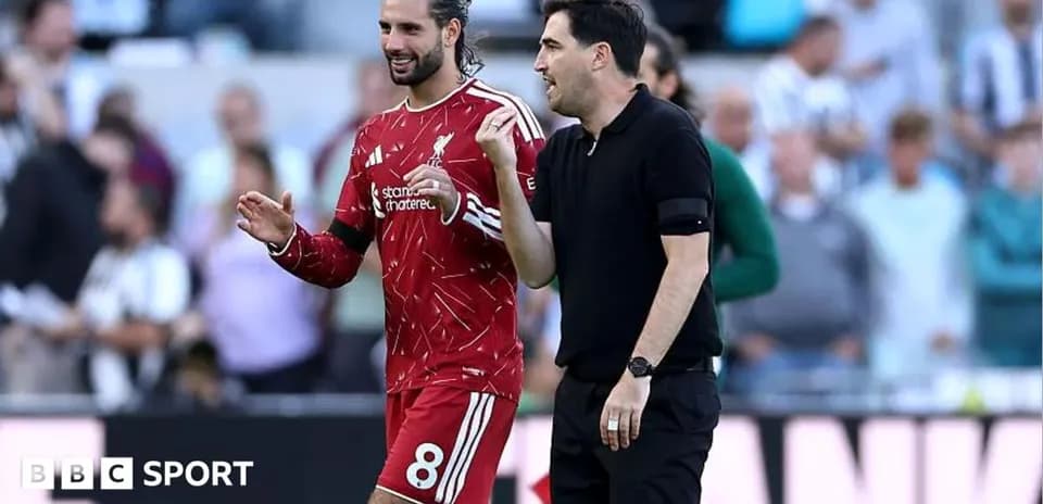 Player and coach discussing on the sidelines