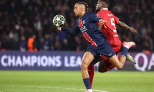 Paris Saint Germain player in action against Liverpool