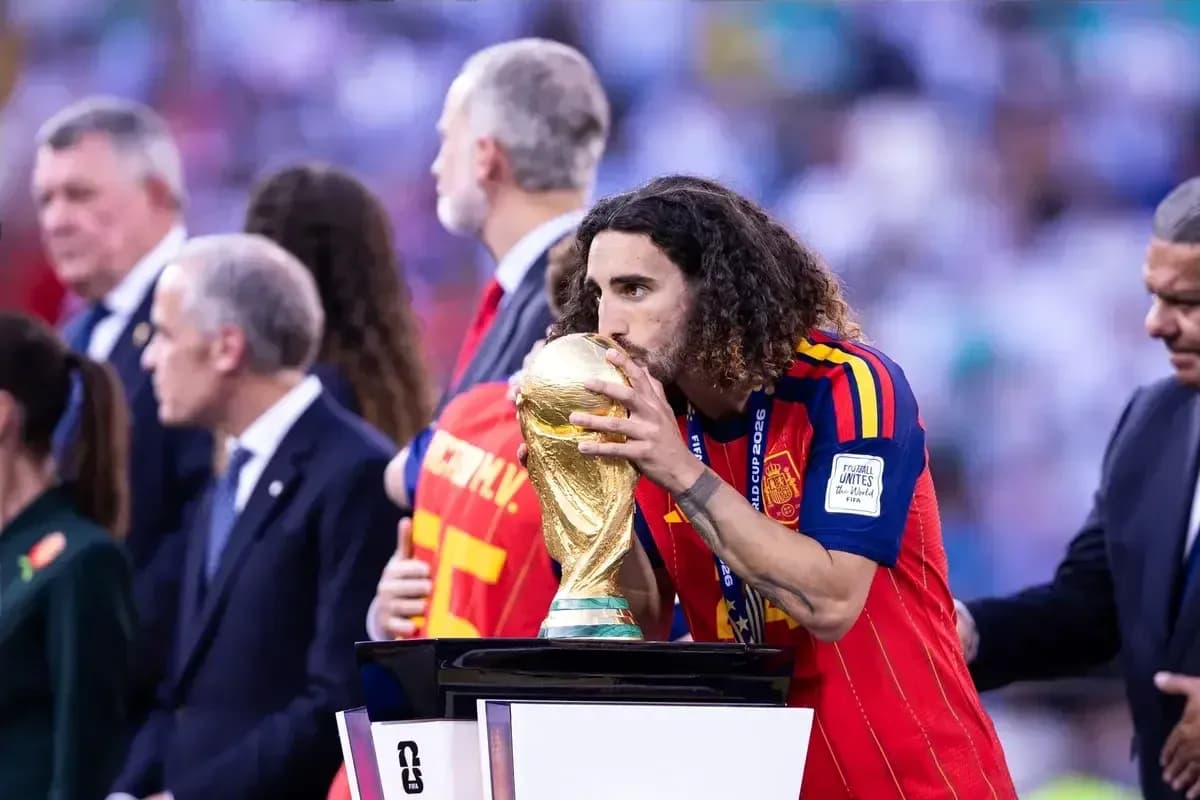 Player kissing FIFA World Cup trophy on podium