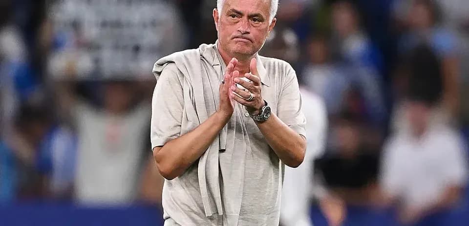 Manager applauding fans after the match
