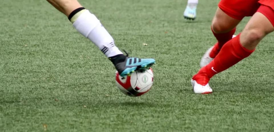 Players contesting for the ball in football match