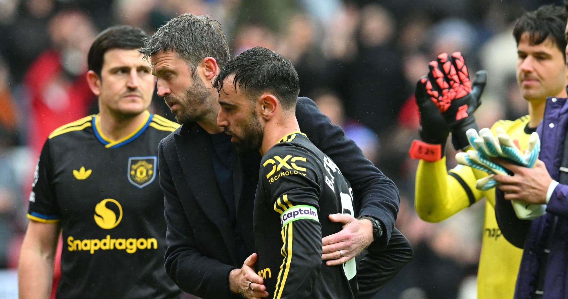 Manager comforting player after match conclusion