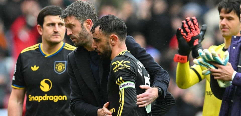 Manager comforting player after match conclusion
