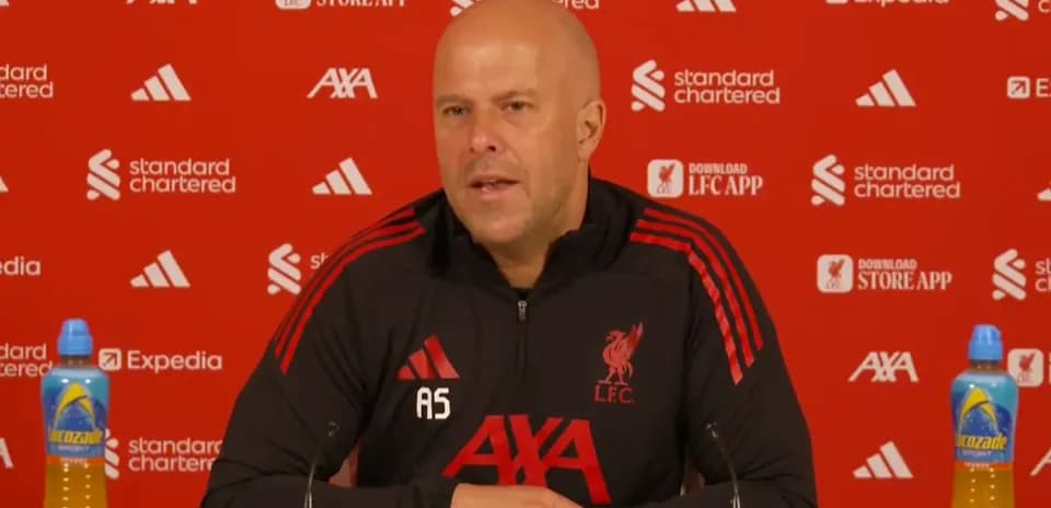 Manager speaking at Liverpool press conference podium