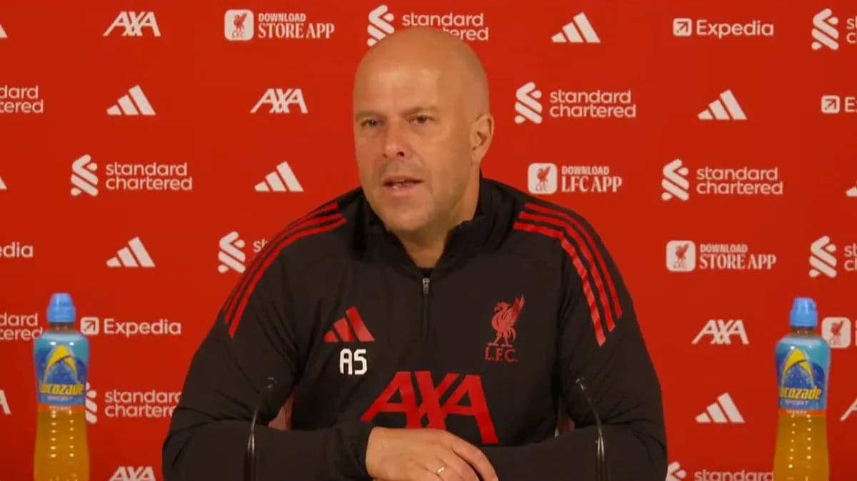 Manager speaking at Liverpool press conference podium