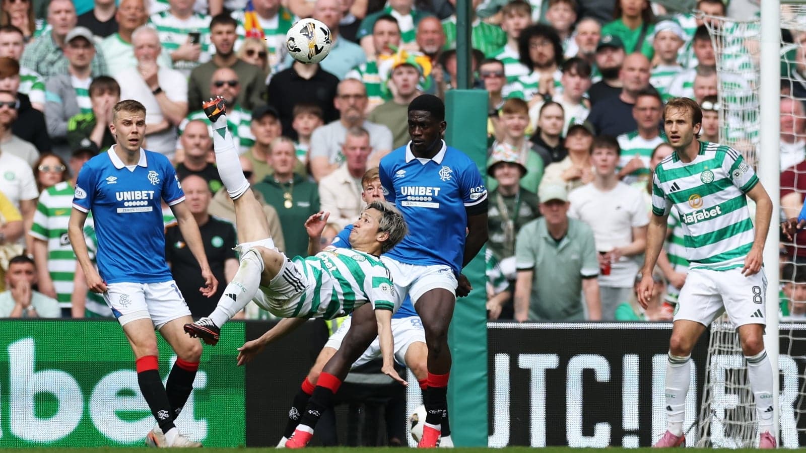 Celtic player performing a bicycle kick in match