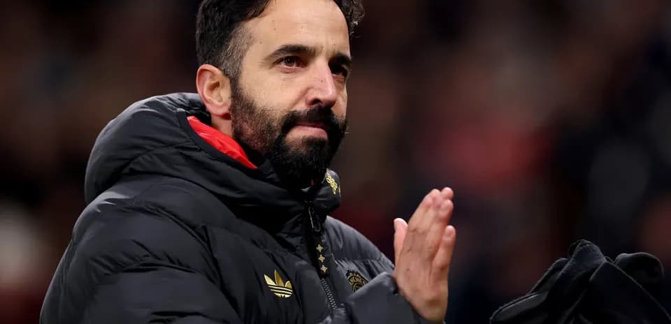 Coach applauding fans during match at stadium