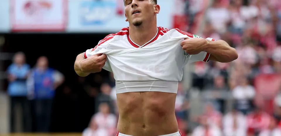 Player lifting shirt during match celebration