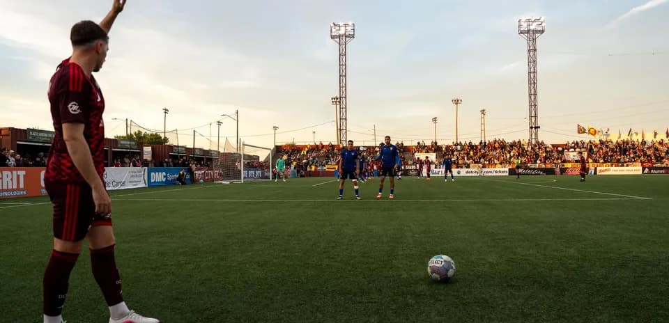 Player preparing for a free kick during match