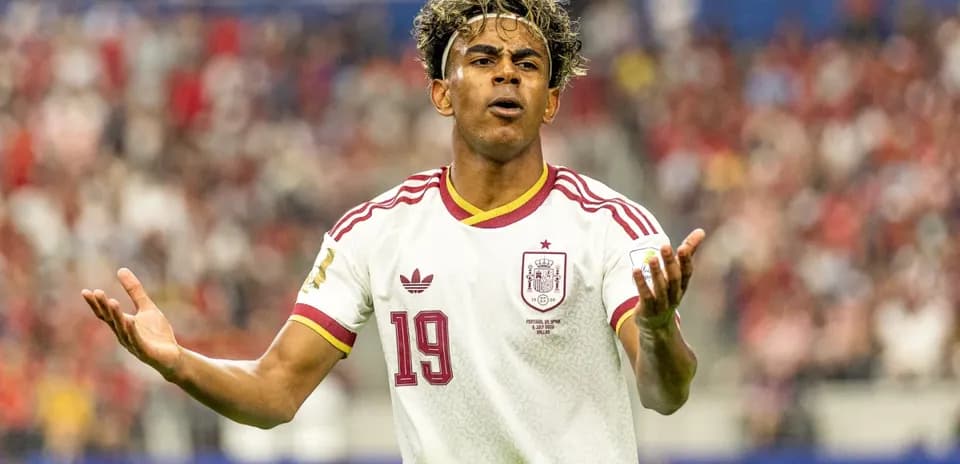 Player gesturing during a match in Spain jersey