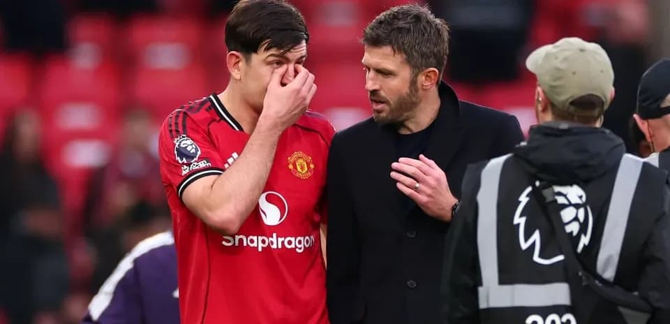 Harry Maguire speaking with Michael Carrick after match