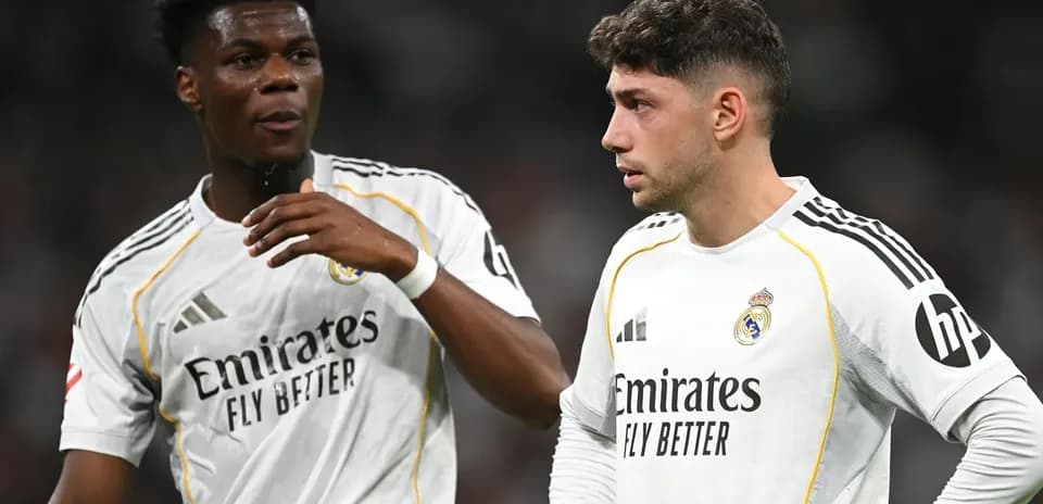 Two Real Madrid players discussing on the field