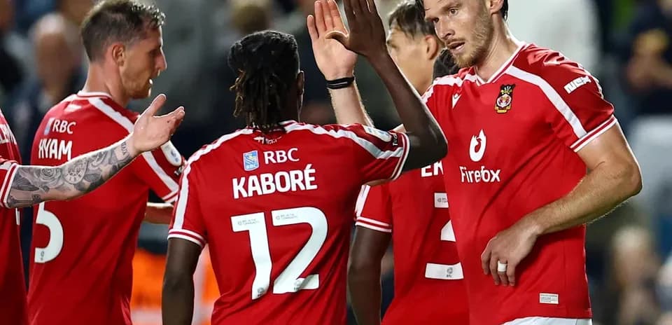 Players celebrating a goal during a match