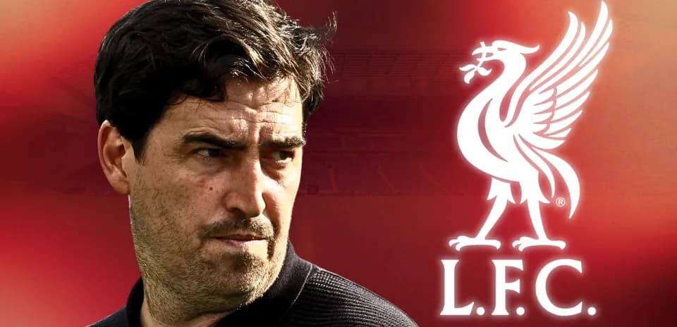 Manager with Liverpool logo in background