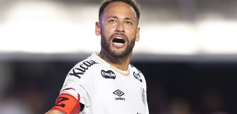 Player celebrating with team jersey and captain's armband