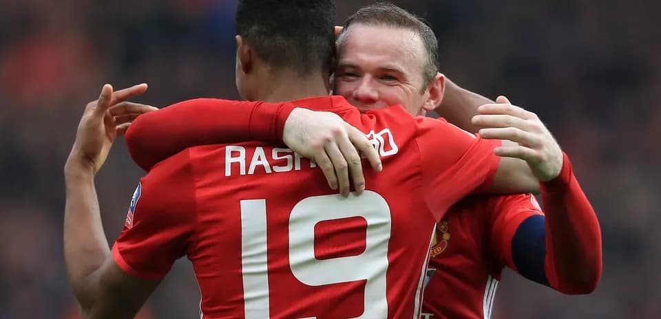 Marcus Rashford and Wayne Rooney celebrating together