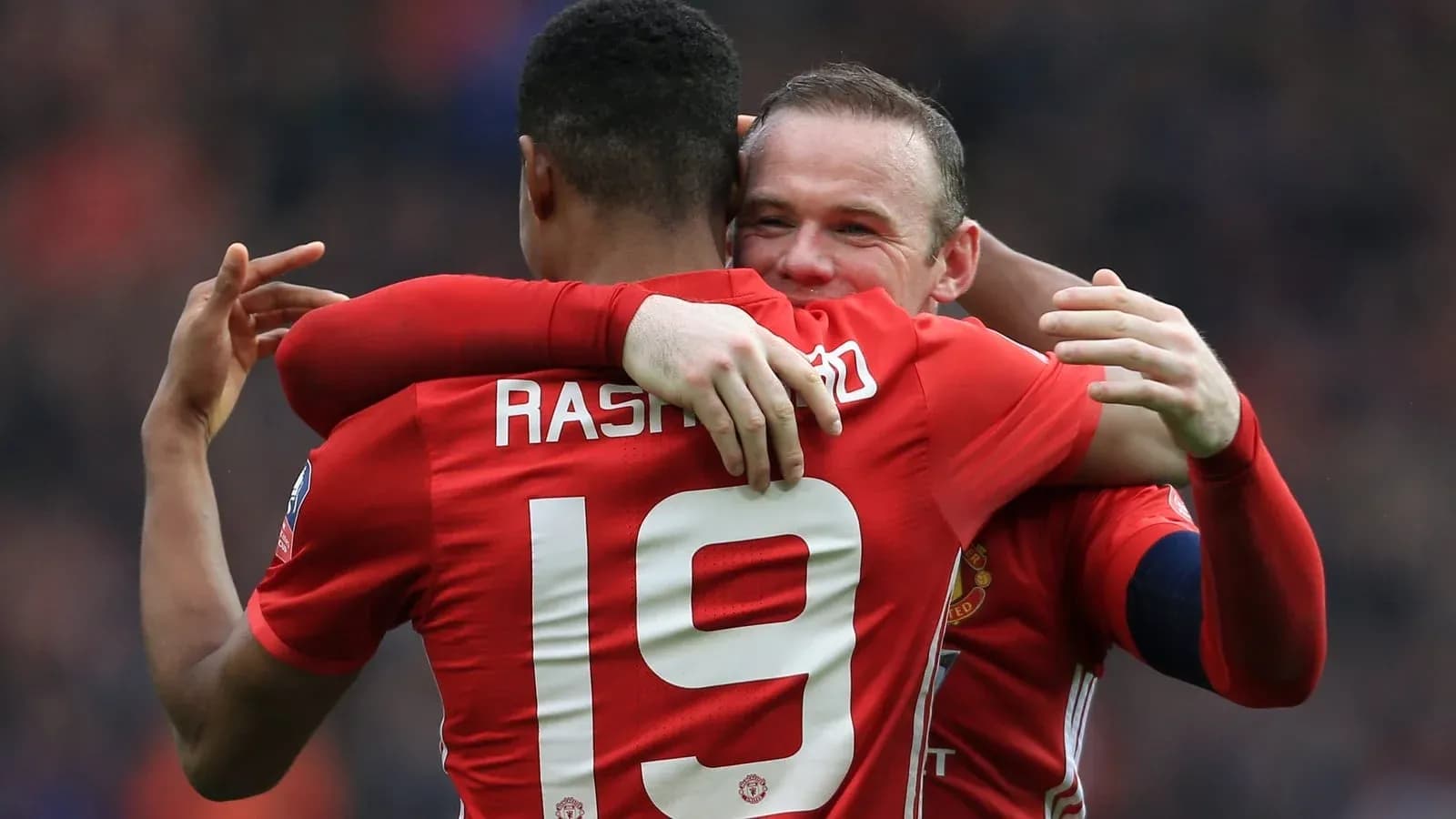 Marcus Rashford and Wayne Rooney celebrating together