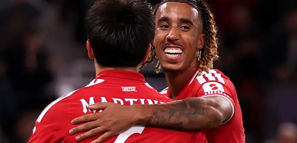Two players celebrating together on the field