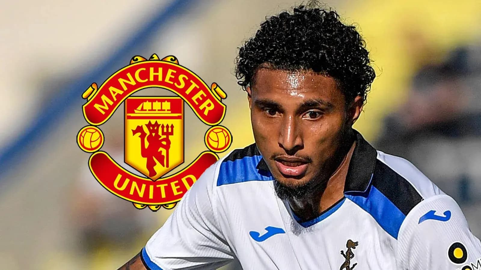 Player in action with Manchester United logo behind