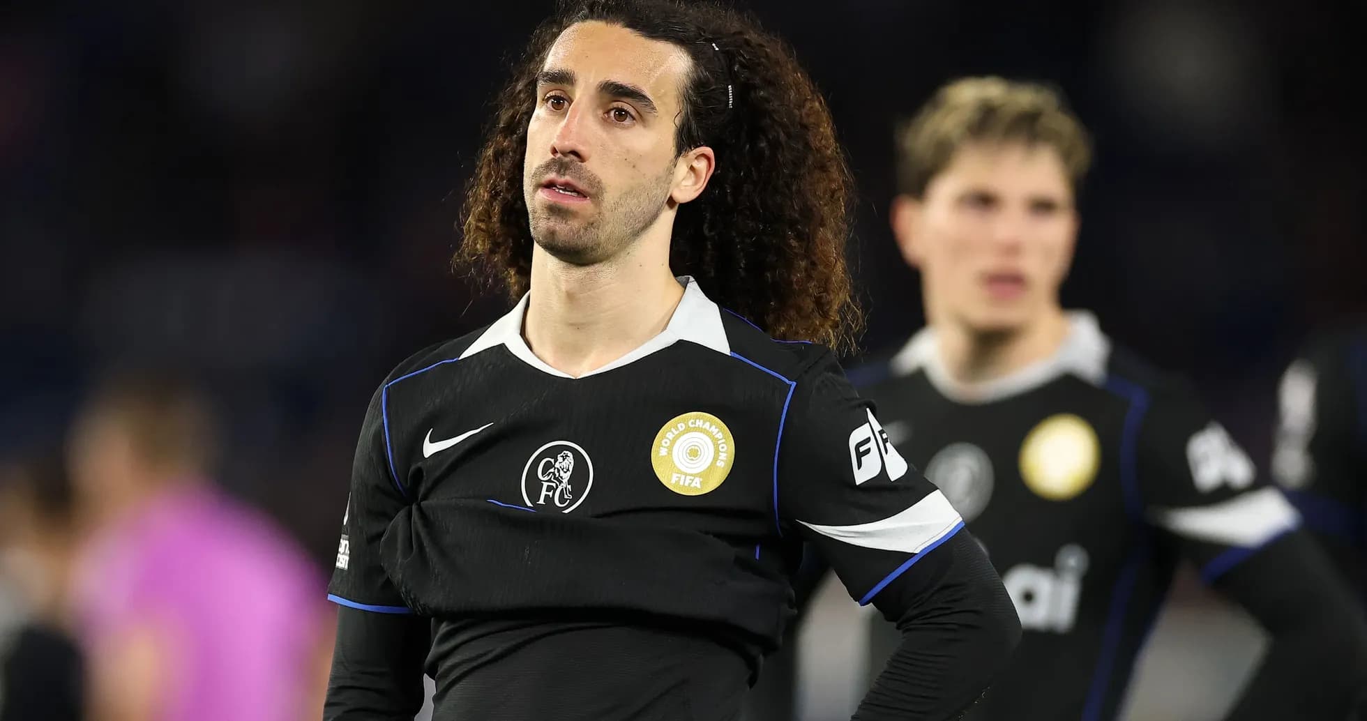 Player in black jersey during match aftermath