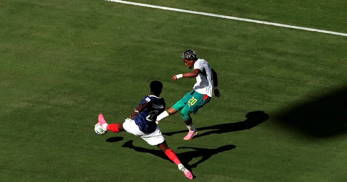 Player attempting to dribble past opponent during match