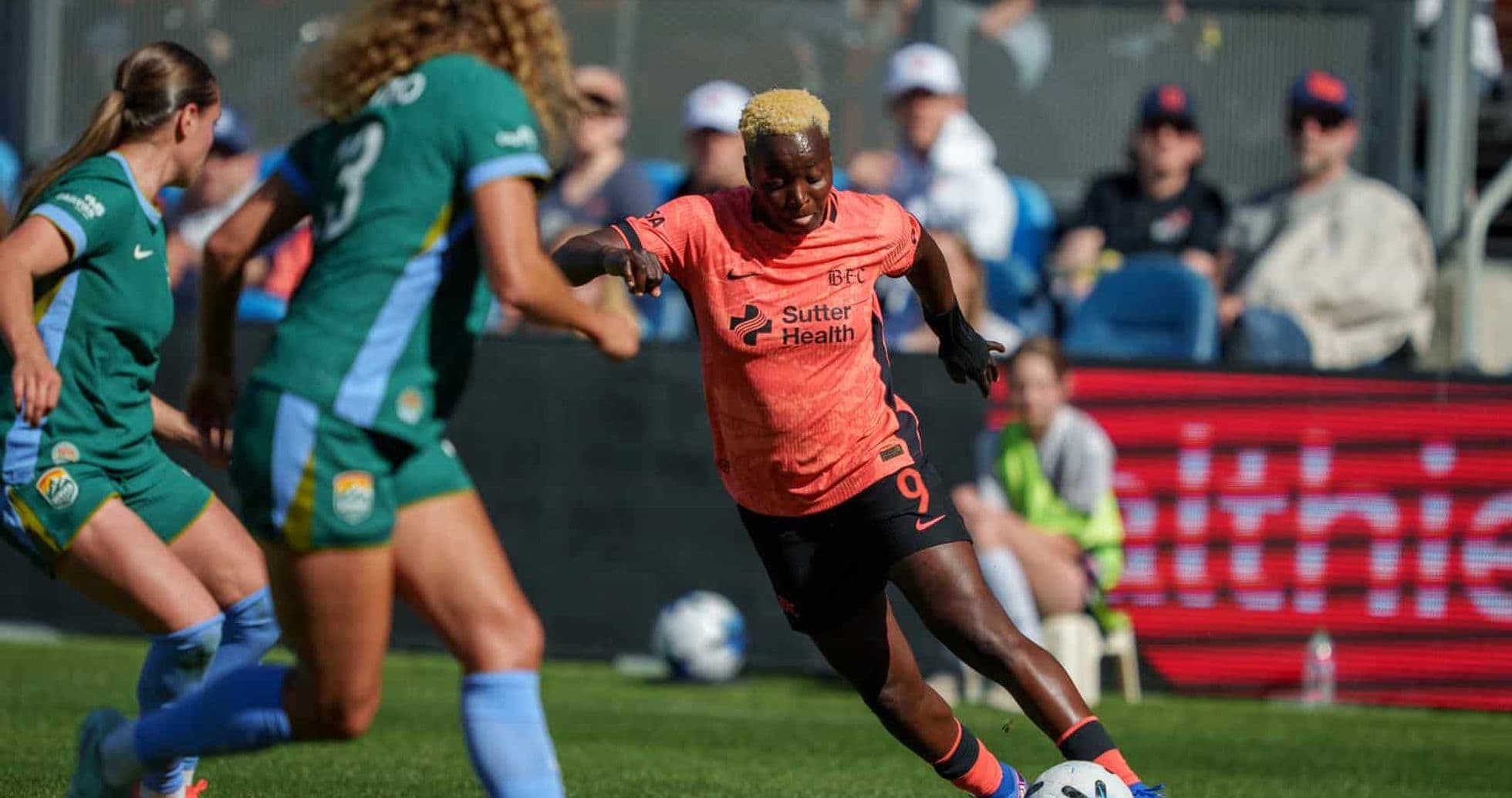 Player dribbling the ball during Bay FC match