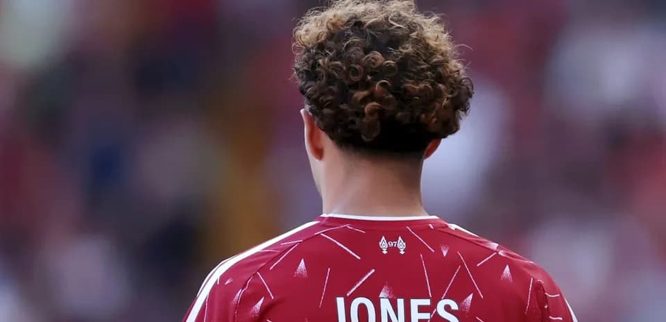 Player in red jersey with 'JONES' on back