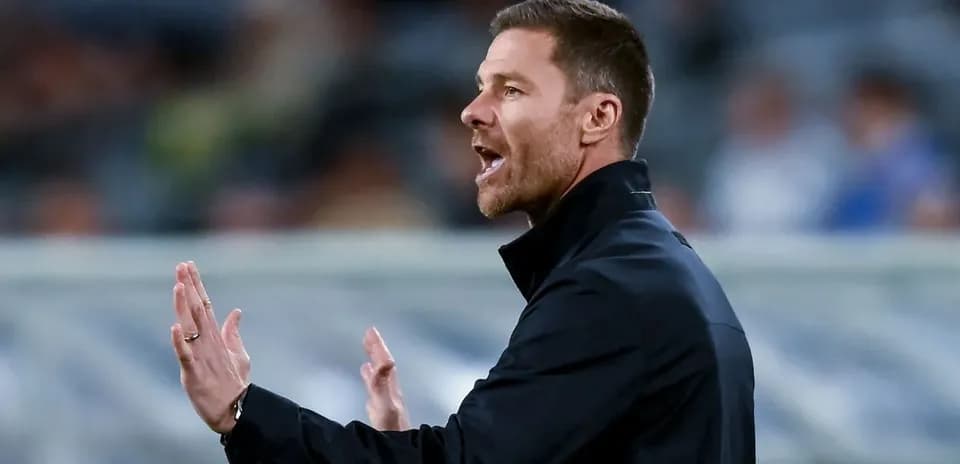 Coach gesturing during a match on the sidelines