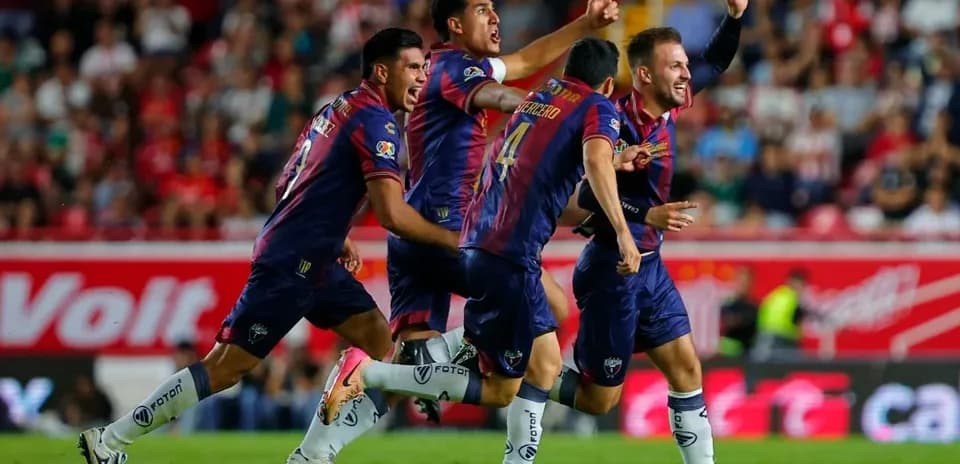 Players celebrating a goal during Liga MX match